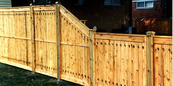 Good Neighbor Cedar Privacy Fencing with holes top and bottom by Elyria Fence