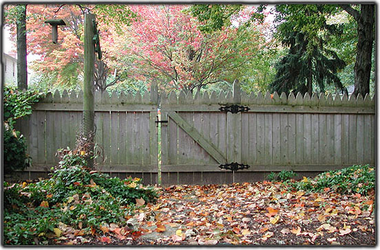 aged picket fence by Elyria Fence