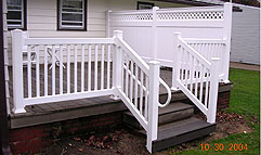 vinyl railing with ADA handrail by Elyria Fence