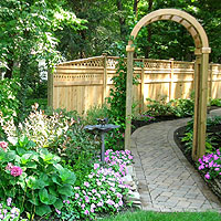garden arch with wood privacy fence