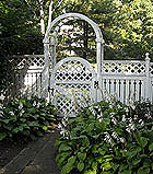 semi private wood fence with arched lattice gate and arbor by elyria fence