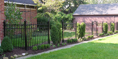 Ornamental Aluminum Fence with spears and arched gates by Elyria Fence Company