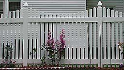 Vinyl spaced scalloped picket fence by Elyria Fence