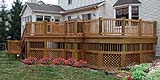 Wooden Deck by Elyria Fence