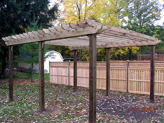wood sun trellis with semi privacy fence by Elyria Fence