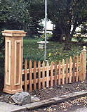 spaced scalloped white cedar wooden picket fence with boxed out post by elyria fence