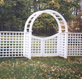 wood arbor with a gate square lattice by elyria fence